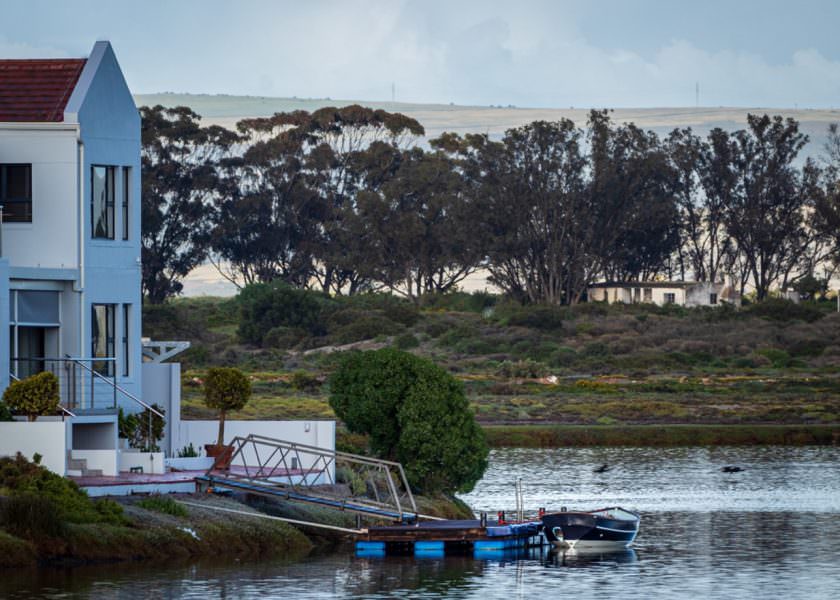 House by lake with boat