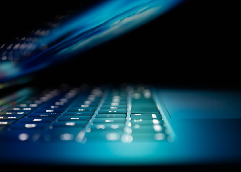 Cyber Insurance Brokers - blue keyboard